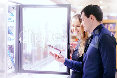 Couple in the frozen goods section