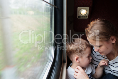 Mother and son on a train trip