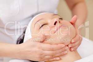 Facial massage at beauty treatment salon