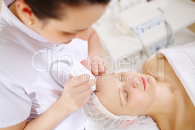Ultrasonic face cleaning at the beauty spa