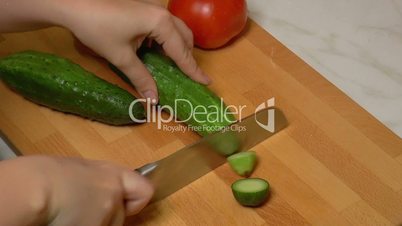 Green Cucumbers Cut into Slices for Cooking, closeup