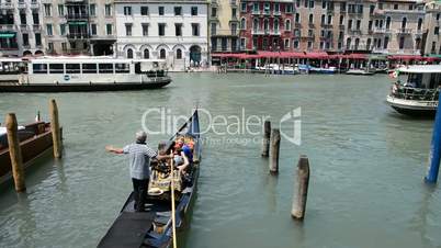 The gondolas with tourists are on Grand Canal, Venice, Italy