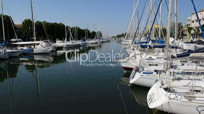 The water channel with parked sail yachts, Rimini, Italy