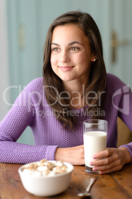 Thinking teenage girl enjoy healthy breakfast