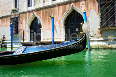 The gondola is on water channel, Venice, Italy