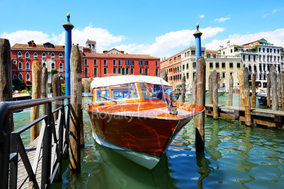 The parked water taxi for tourists transportation is on Grand Ca