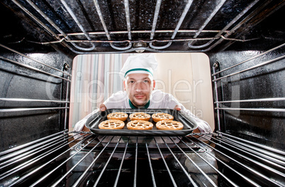 Chef cooking in the oven.