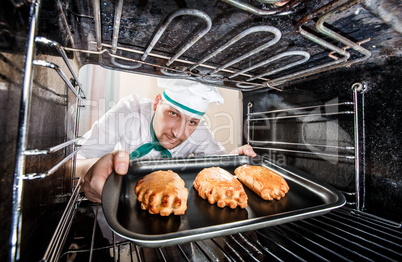 Chef cooking in the oven.