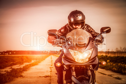 Biker racing on the road