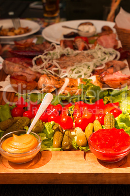 Table in the Restaurant. Vegetables and Meat