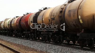 Freight train with tank cars passing by