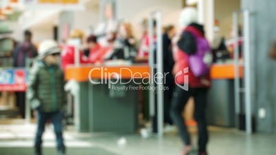 Customers in the supermarket paying at ther cashdesk