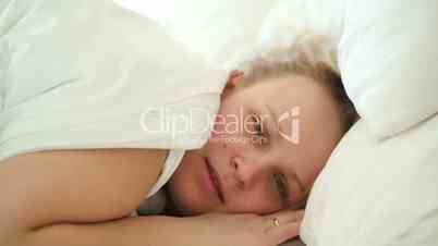 Woman hardly waking up in the morning