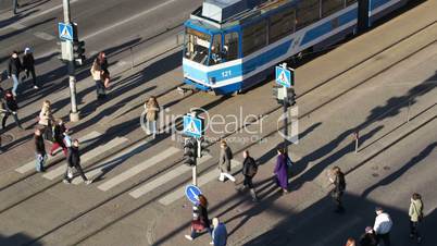 Crowd of people on zebra crossing in Tallin, Europe