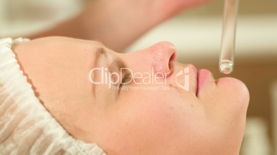 Facial procedure at beauty spa with laser using