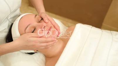 Facial treatment with professional massage of cosmetician
