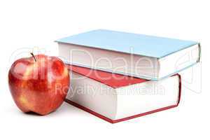books and red apple