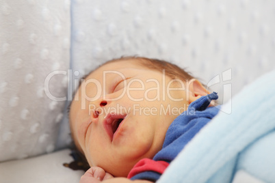 Newborn yawing.  Focus in the mouth