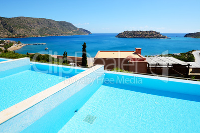 Swimming pool at luxury hotel with a view on Spinalonga Island,