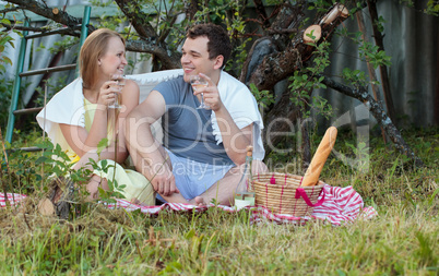 Young couple on picnic in the countryside