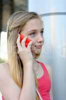 Young girl talking on the phone outdoor