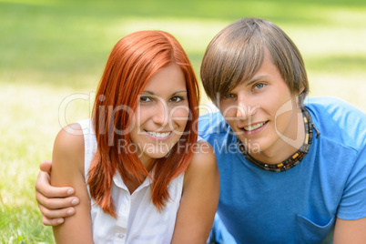 Teenage couple enjoy summer day smiling