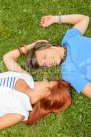 Romantic love young couple lying on grass