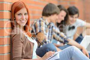 Young student woman friends sitting in background