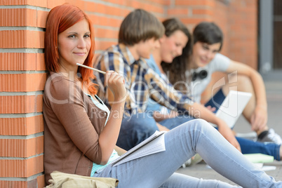 Young studying woman friends sitting in background