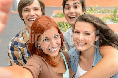 Group of student teenage friends taking selfie