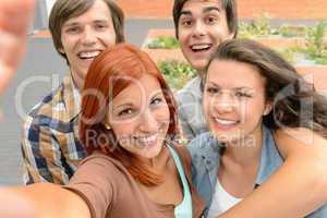 Group of student teenage friends taking selfie