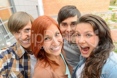 Cheerful student friends taking selfie