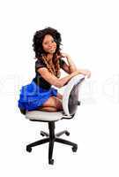 Girl kneeling on chair.