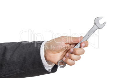 Business man hand with wrench