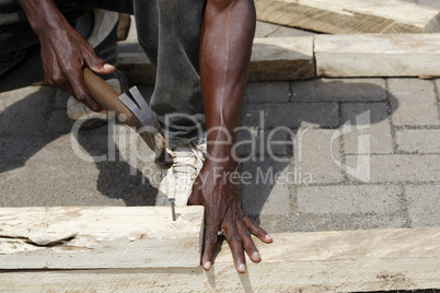 African carpenter works with wood