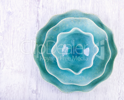 Blue dinner plates on a white wooden table