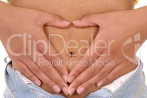 Woman holding hands on stomach.