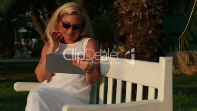 Woman Surfing Internet On Digital Tablet