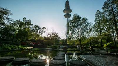 Hamburg Planten un Bloom city park with tv tower - sunset - DSLR dolly shot timelapse