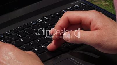 hands on a computer keyboard,laptop