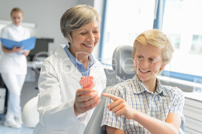 Teenage boy point teeth denture dentist checkup