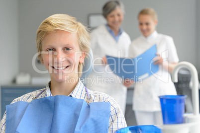 Teenage patient at dental surgery dentist nurse