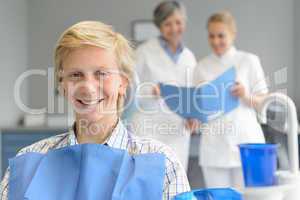 Teenage patient at dental surgery dentist nurse