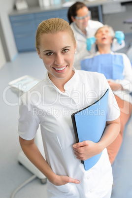 Dental assistant dentist checkup patient