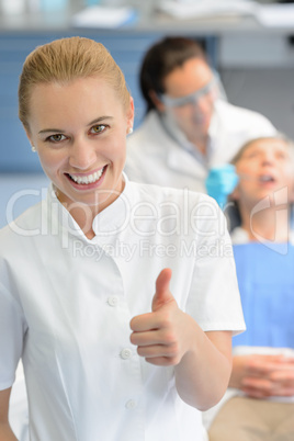 Dental assistant dentist checkup patient  thumbup