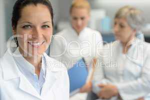 Professional dentist woman nurse with patient