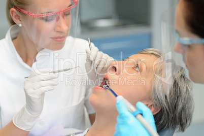 Dental team checkup elderly patient woman teeth