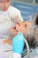Professional dentists checkup senior patient woman