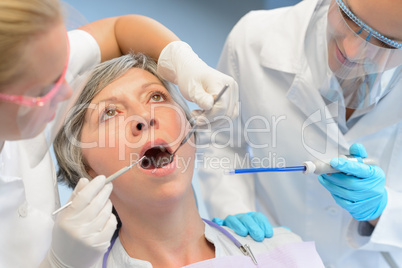 Dental check elderly woman patient dentist team