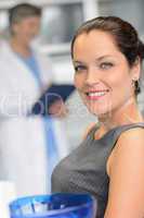 Elegant woman patient at dentist surgery smiling